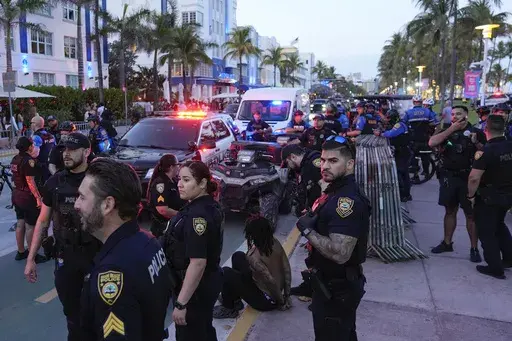 City of Miami Beach police officers respond to an incident during spring break, March 15, 2024, in Miami Beach, Fla. (AP Photo/Rebecca Blackwell, File)