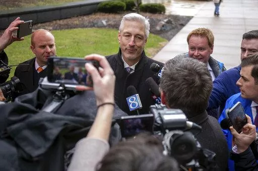 Michael Hills, the defense attorney representing Brandon Caserta, speaks to a scrum of reporters after Casterta was found not guilty of conspiring to kidnap and weapons charges outside the Gerald R. Ford Federal Building and Courthouse in Grand Rapids, Mich., Friday, April 8, 2022. Jurors have acquitted two defendants, Daniel Harris and Caserta, of all charges in a plot to kidnap Michigan Gov. Gretchen Whitmer but couldn't agree on a verdict for two others. (Daniel Shular/MLive.com/The Grand Rap