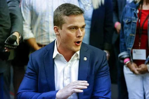 U.S. Rep. Madison Cawthorn, R-N.C., speaks to supporters and the media at his primary election night watch party in Hendersonville, N.C., Tuesday, May 17, 2022. (AP Photo/Nell Redmond)