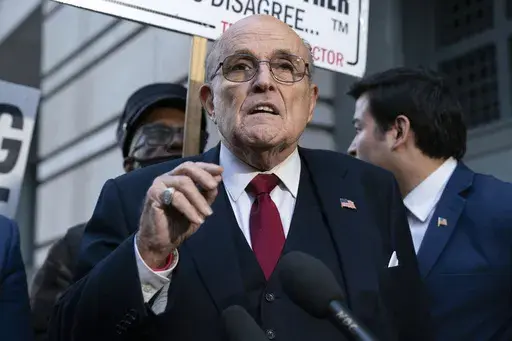 Former Mayor of New York Rudy Giuliani speaks during a news conference outside the federal courthouse in Washington, Dec. 15, 2023. Giuliani, also a former Donald Trump attorney, was processed Monday, June 10, 2024, in the criminal case over the effort to overturn Trump’s Arizona election loss to Joe Biden, the Maricopa County Sheriff's Office said. (AP Photo/Jose Luis Magana, File)