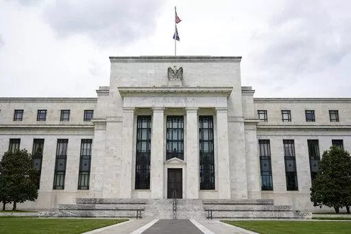 This May 4, 2021, file photo shows the Federal Reserve building in Washington. The Federal Reserve is poised this week to begin unleashing its most drastic steps in three decades to attack inflation by making it costlier to borrow — for a car, a home, a business deal, a credit card purchase — all of which will compound Americans' financial strains and likely weaken the economy. The Fed is expected to announce Wednesday, May 3, 2022 that it will begin quickly shrinking its vast stockpile of T