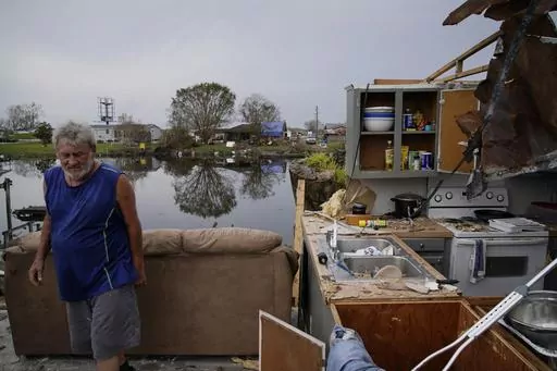 Philip Adams walks through what remains of his living room and kitchen at his hurricane destroyed home in the aftermath of Hurricane Ida, on Sept. 6, 2021, in Lockport, La. Experts caution that attributing any single event to La Nina or its better-known cousin, El Nino, is difficult as they pronounced Thursday, March 9, 2023, that the La Nina weather phenomenon has come to an end. But they can say generally that tornadoes in the Southeast and hurricanes are more frequent during La Nina. (AP Phot