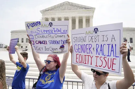 People demonstrate outside the Supreme Court, June 30, 2023, in Washington. (AP Photo/Jacquelyn Martin, File)