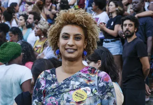 In this Jan. 9, 2018 file photo, Rio de Janeiro Councilwoman Marielle Franco smiles for a photo in Cinelandia square. Brazil’s federal police arrested on Sunday, March 24, 2024 the men suspected of ordering Franco's killing in 2018, a long-awaited step after years of society clamoring for justice. (AP Photo/Ellis Rua, File)