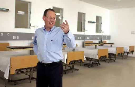 In this picture taken Jan. 10, 2012, Partners in Health's co-founder, Dr. Paul Farmer, gestures during the inauguration of national referral and teaching hospital in Mirebalais, 30 miles (48 kilometers) north of Port-au-Prince, Haiti. Dr. Paul Farmer, a physician, humanitarian and author renowned for providing health care to millions of impoverished people, has died. He was 62. Farmer co-founded the global nonprofit Partners in Health, which confirmed his death Monday, Feb. 21, 2022. (AP Photo/D