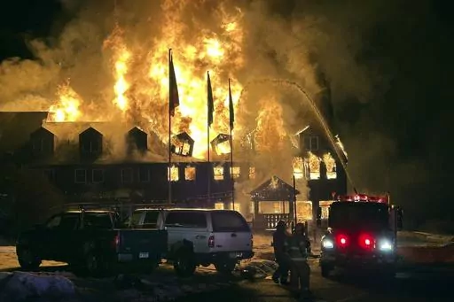 Firefighters battle an overnight blaze that destroyed the Lutsen Lodge on the North Shore of Lake Superior, early Tuesday, Feb. 6, 2024, in Lutsen, Minn. (Edward Vanegas via AP)