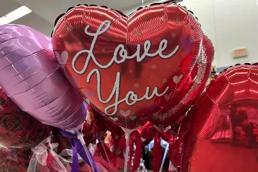 Valentine's Day balloons are displayed at a grocery store in Glenview, Ill., Monday, Feb. 10, 2025. (AP Photo/Nam Y. Huh)