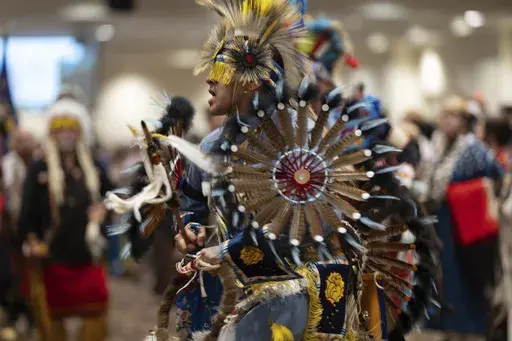 People dance during a powwow at Chinook Winds Casino Resort, Saturday, Nov. 16, 2024, in Lincoln City, Ore. (AP Photo/Jenny Kane)