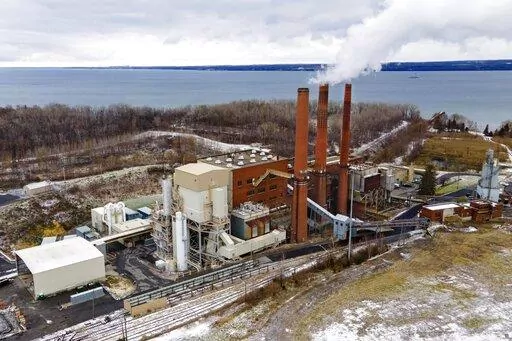 The Greenidge Generation bitcoin mining facility, in a former coal plant by Seneca Lake in Dresden, New York, is shown in this photo from Nov. 29, 2021. A milestone measure that would tap the brakes on the spread of cryptocurrency mining operations burning fossil fuels in New York has passed the state Legislature. The bill approved early Friday, June 3, 2022,  by the state Senate would establish a two-year moratorium on new and renewed air permits for fossil fuel power plants used for energy-int