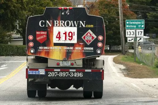 A fuel delivery truck advertises its price for a gallon of heating oil, Oct. 5, 2022 in Livermore Falls, Maine. The Labor Department releases the Producer Price Index for October on Tuesday. (AP Photo/Robert F. Bukaty, File)