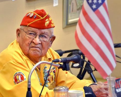 In this 2013 photo, Navajo Code Talker Samuel Sandoval talks about his experiences in the military in Cortez, Colo. Sandoval, one of the last remaining Navajo Code Talkers who transmitted messages in World War II using a code based on their native language, has died at age 98. Sandoval died late Friday, July 29, 2022, at a hospital in Shiprock, N.M., his wife, Malula told The Associated Press on Saturday. (Sam Green/The Cortez Journal via AP)