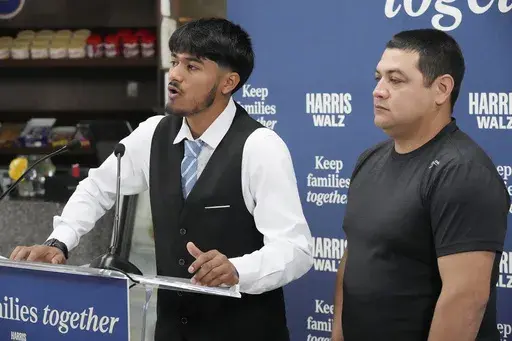 Billy and his father, no last name given, speak at a Democratic Party campaign event, about their experience of being separated when they crossed the U.S.- Mexico border during the Trump administration, Oct. 16, 2024, in Doral, Fla. (AP Photo/Marta Lavandier, File)