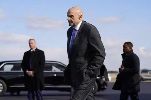 Sen. John Fetterman, D-Pa., walks to a motorcade vehicle after stepping off Air Force One behind President Joe Biden, Feb. 3, 2023, at Philadelphia International Airport in Philadelphia. On Thursday, Feb. 16, Fetterman's office announced that the senator had checked himself into the hospital for clinical depression.(AP Photo/Patrick Semansky, File)