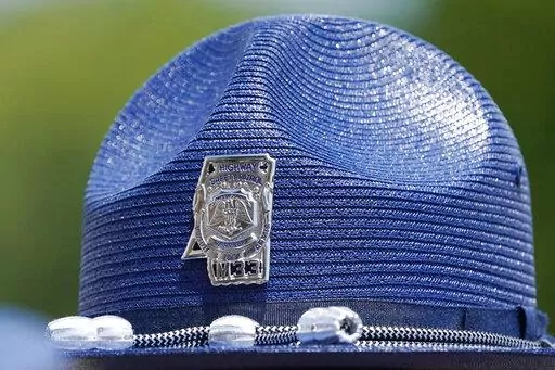 The emblem of a Mississippi Highway Patrol badge on a "cover," the hat worn by uniformed officers, is shown June 30, 2021, taken at a ceremony in Pearl, Miss. The Mississippi Department of Public Safety said on Aug. 12, 2022, that its investigation into an incident involving a white Mississippi Highway Patrol officer and three Black men showed no evidence of criminal conduct by the state trooper. The investigation was launched after a viral video showed the officer putting a handcuffed man into 