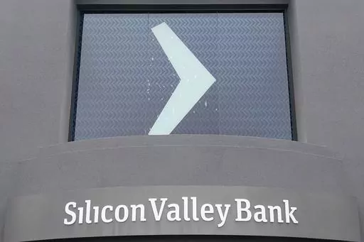 A Silicon Valley Bank sign is shown at the company's headquarters in Santa Clara, Calif., Friday, March 10, 2023. The Federal Deposit Insurance Corporation is seizing the assets of Silicon Valley Bank, marking the largest bank failure since Washington Mutual during the height of the 2008 financial crisis. The FDIC ordered the closure of Silicon Valley Bank and immediately took position of all deposits at the bank Friday. (AP Photo/Jeff Chiu)