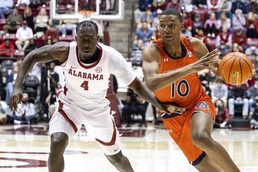 Auburn forward Jabari Smith (10) works around Alabama forward Juwan Gary (4) during the first half of an NCAA college basketball game, Tuesday, Jan. 11, 2022, in Tuscaloosa, Ala. (AP Photo/Vasha Hunt)