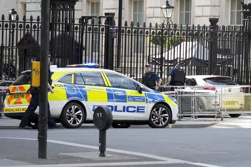 Police at the scene after a car collided with the gates of Downing Street in London in London, Thursday, May 25, 2023. Police say a car has collided with the gates of Downing Street in central London, where the British prime minister's home and offices are located. The Metropolitan Police force says there are no reports of injuries. Police said a man was arrested at the scene on suspicion of criminal damage and dangerous driving. It was not immediately clear whether the crash was deliberate. (AP