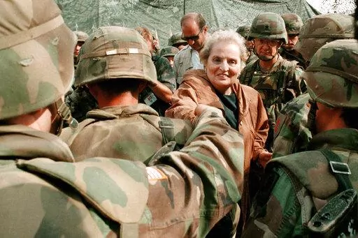 Secretary of State Madeleine Albright greets US Soldiers at Bondsteel camp near Urosevac, some 35 kms. south of Pristina, July 29, 1999. (AP Photo/Amel Emric, File)