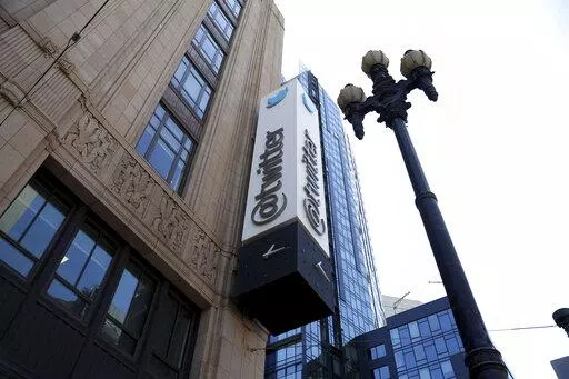 A sign is pictured outside the Twitter headquarters in San Francisco, Monday, April 25, 2022. Trading in shares of Twitter were halted, Tuesday, Oct. 4,  after the stock spiked on reports that Elon Musk would proceed with his $44 billion deal to buy the company after months of legal battles.(AP Photo/Jed Jacobsohn, File)
