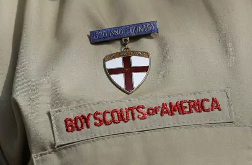 A close up of a Boy Scout uniform is photographed on Feb. 4, 2013, in Irving, Texas. On Tuesday, March 28, 2023, a federal district court judge upheld the approval of a $2.4 billion bankruptcy reorganization plan aimed at resolving tens of thousands of child sexual abuse claim against the Boy Scouts of America. (AP Photo/Tony Gutierrez, File)