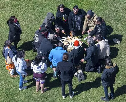 A group of singers from the Wabanaki Confederacy drum and sing before a news conference in support of the tribal sovereignty bills Wednesday, April 20, 2022, in front of the Maine State House in Augusta, Maine. (Joe Phelan/The Kennebec Journal via AP)