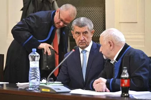 Former prime minister Andrej Babis, center, at the Prague Municipal Court in Prague. Czech Republic, Monday, Sept. 12, 2022.  Babis goes on trial after the prosecution indicted him in a $2 million fraud case involving European Union subsidies. (Vit Simanek/CTK via AP).