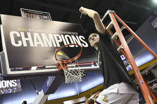 Lipscomb forward Jacob Ognacevic (41) holds up a piece of the net after the team's win in the Atlantic Sun Conference championship NCAA college basketball game against North Alabama, Sunday, March 9, 2025, in Nashville, Tenn. (AP Photo/John Amis)
