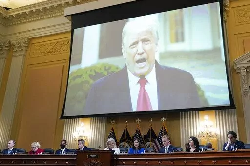 A video of President Donald Trump is shown on a screen, as the House select committee investigating the Jan. 6 attack on the U.S. Capitol holds a hearing at the Capitol in Washington, July 21, 2022. The House committee investigating the Capitol riot will hold its final meeting Monday, Dec. 19, wrapping up its year-and-a-half-long inquiry by asking the Justice Department to investigate potential crimes. (AP Photo/J. Scott Applewhite, File)