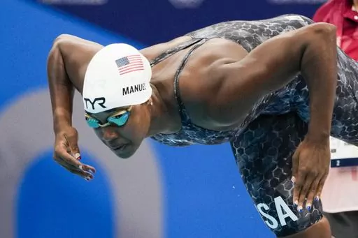 Simone Manuel, of United States, swims in a women's 50-meter freestyle heat at the 2020 Summer Olympics, Friday, July 30, 2021, in Tokyo, Japan. The Soul Cap has gotten the green light from swimming's top governing body, which figures to be a huge step toward bringing more diversity to a largely white sport. The oversized cap, which is designed to make it more comfortable for Black swimmers to hit the water with natural hair, will likely have its biggest influence at the grassroots level. That, 