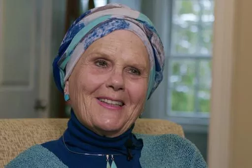 In this image taken from video, Lynda Bluestein smiles during an interview in the living room of her home, Feb. 28, 2023, in Bridgeport, Conn. Bluestein, who pushed for expanded access to Vermont's law that allows people who are terminally ill to receive lethal medication to end their lives, died in Vermont on Thursday, Jan. 4, 2024. Bluestein had terminal cancer and ended her life by taking prescribed medication. (AP Photo/Rodrique Ngowi, File)