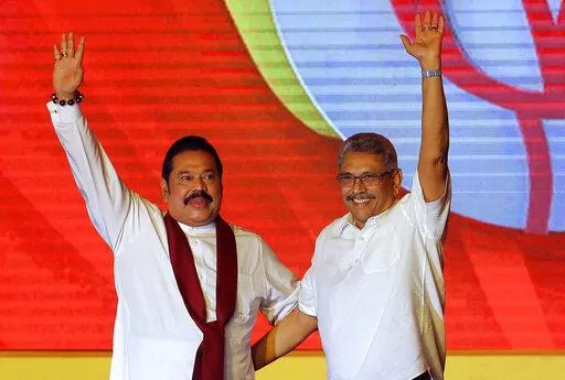 Mahinda Rajapaksa, left, and his brother Gotabaya Rajapaksa wave to supporters during a party convention held to announce the presidential candidacy in Colombo, Sri Lanka, Aug. 11, 2019. Sri Lanka’s main opposition party on Tuesday, May 3, 2022, issued a no-confidence declaration aiming at ousting Prime Minister Mahinda Rajapaksa and his Cabinet and blaming them of failing in their constitutional duty to provide a decent living standards amid the island nation's worst economic crisis in memory