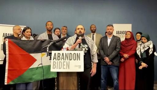 In this image taken from video, Muslim community leaders from several swing states pledge to withdraw support for U.S. President Joe Biden on Saturday, Dec. 2, 2023, at a conference in Dearborn, Mich., citing his refusal to call for a cease-fire in Gaza. (#AbandonBiden via AP)