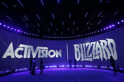 The Activision Blizzard Booth is shown on June 13, 2013, during the Electronic Entertainment Expo in Los Angeles. British antitrust regulators scrutinizing Microsoft's blockbuster purchase of videogame maker Activision Blizzard narrowed their investigation on Friday, March 24, 2023 by dropping concerns the deal would hurt the console gaming market. (AP Photo/Jae C. Hong, File)
