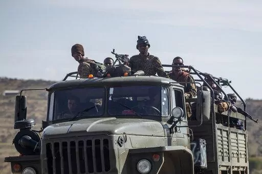 Ethiopian government soldiers ride in the back of a truck on a road near Agula, north of Mekele, in the Tigray region of northern Ethiopia on May 8, 2021. Authorities in Ethiopia's northern Tigray region alleged Wednesday, Aug. 24, 2022 that Ethiopia's military launched a "large-scale" offensive for the first time in a year, while Ethiopia's military spokesman did not immediately respond to questions. (AP Photo/Ben Curtis, File)