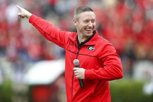 Georgia head basketball coach Mike White on the field before Georgia's spring NCAA college football game on April 16, 2022, in Athens, Ga. (AP Photo/Brett Davis, File)