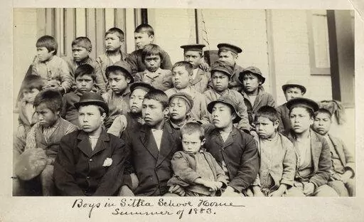 This photo made available by the Presbyterian Historical Society, Philadelphia shows students at a Presbyterian boarding school in Sitka, Alaska in the summer of 1883. U.S. Catholic and Protestant denominations operated more than 150 boarding schools between the 19th and 20th centuries. Native American and Alaskan Native children were regularly severed from their tribal families, customs, language and religion and brought to the schools in a push to assimilate and Christianize them. (Presbyteria